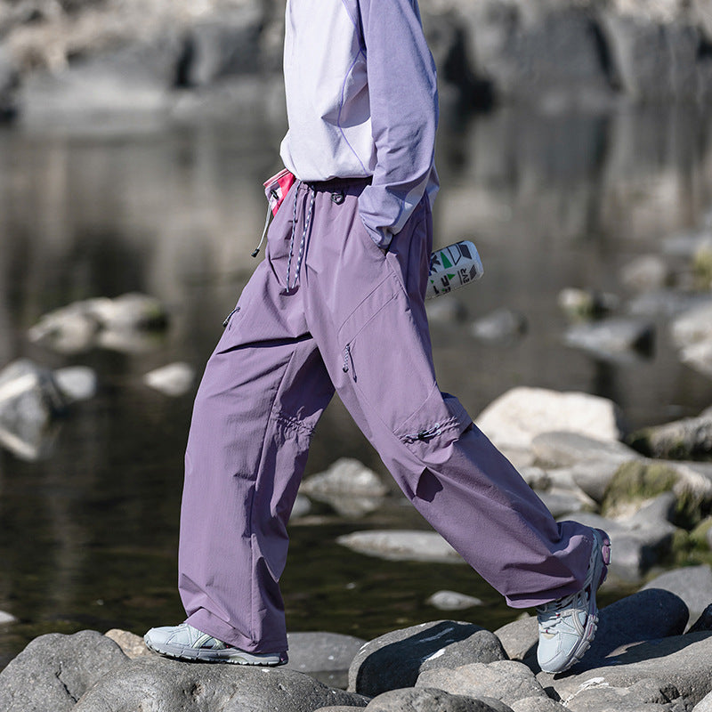 Men's loose technical cargo pants with drawstring, zipper pockets, and adjustable hem Mune Fashion