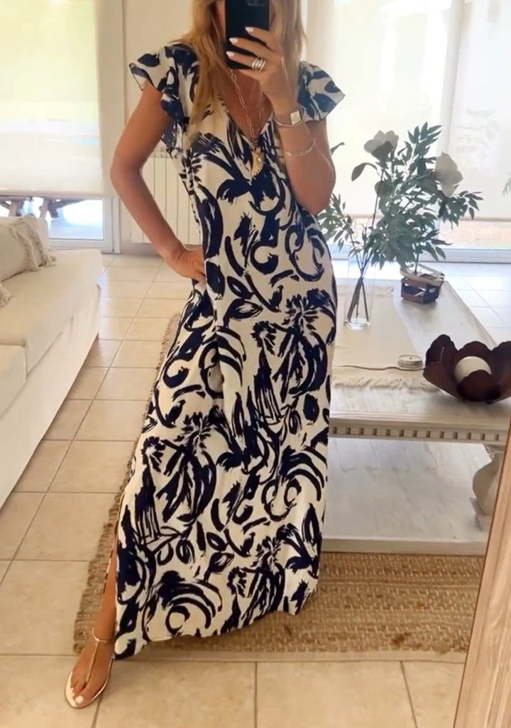 Women's flowing maxi dress with V-neck, flutter sleeves, and side leg slit Mune Fashion