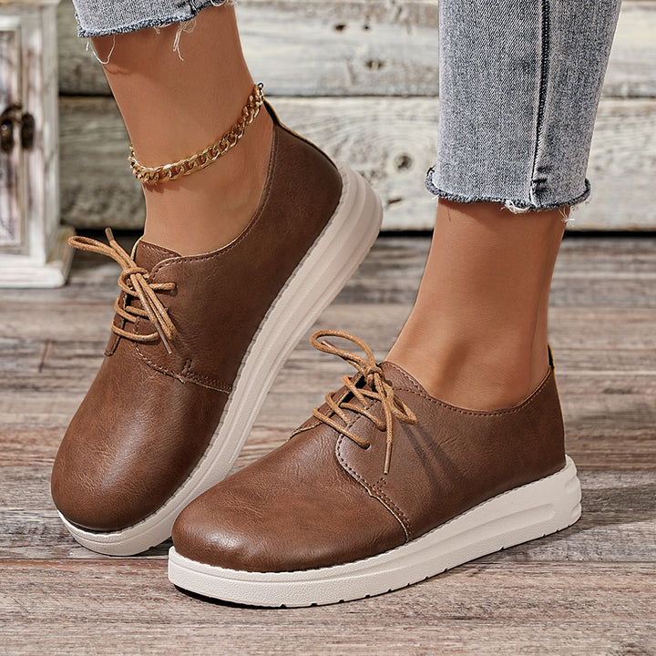 Women's lace-up sneakers made of synthetic leather with a cushioned comfort footbed and light profile sole Mune Fashion
