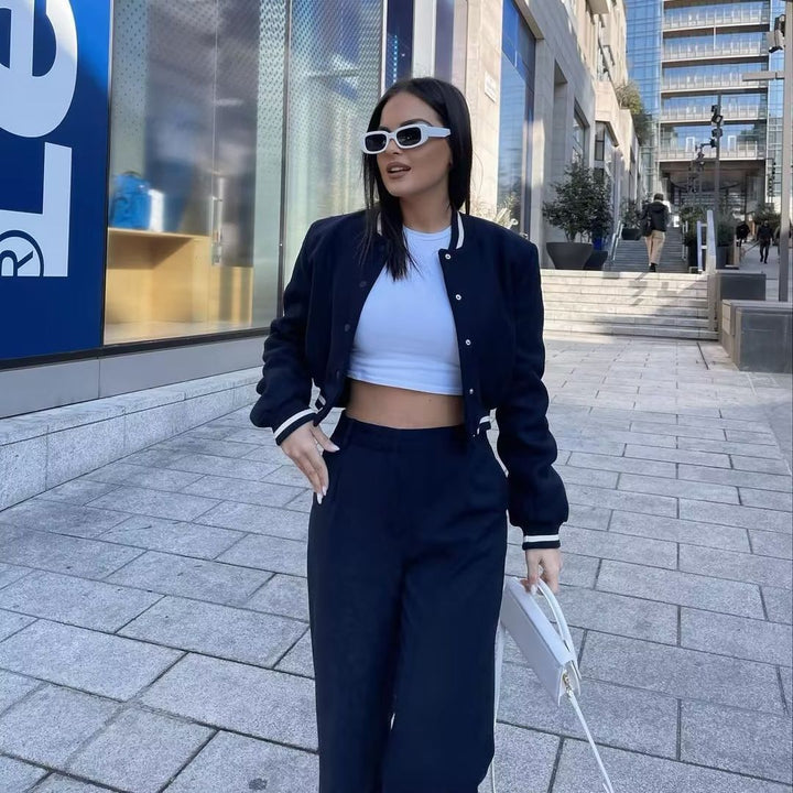 Women nan short college bomber jacket with snap button closure, ribbed stripe waistband and side pockets Mune Fashion