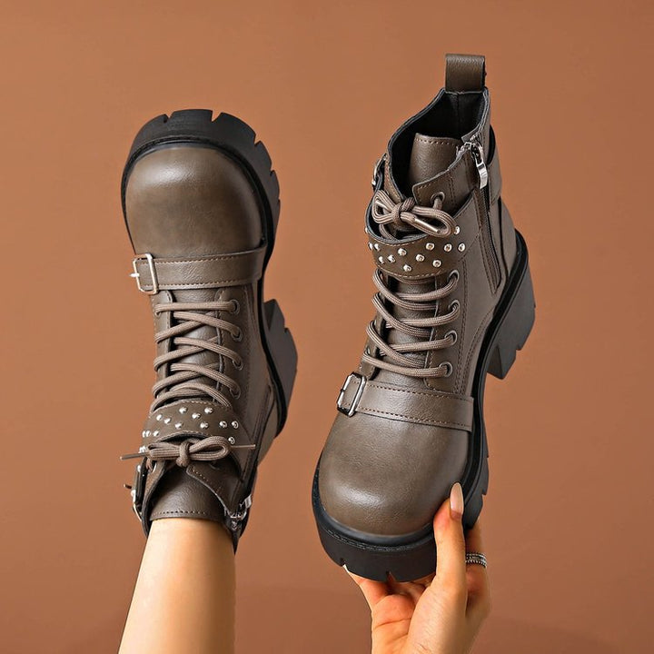 Women's rugged lace-up biker boots with decorative studded straps, side zipper, and textured platform sole Mune Fashion