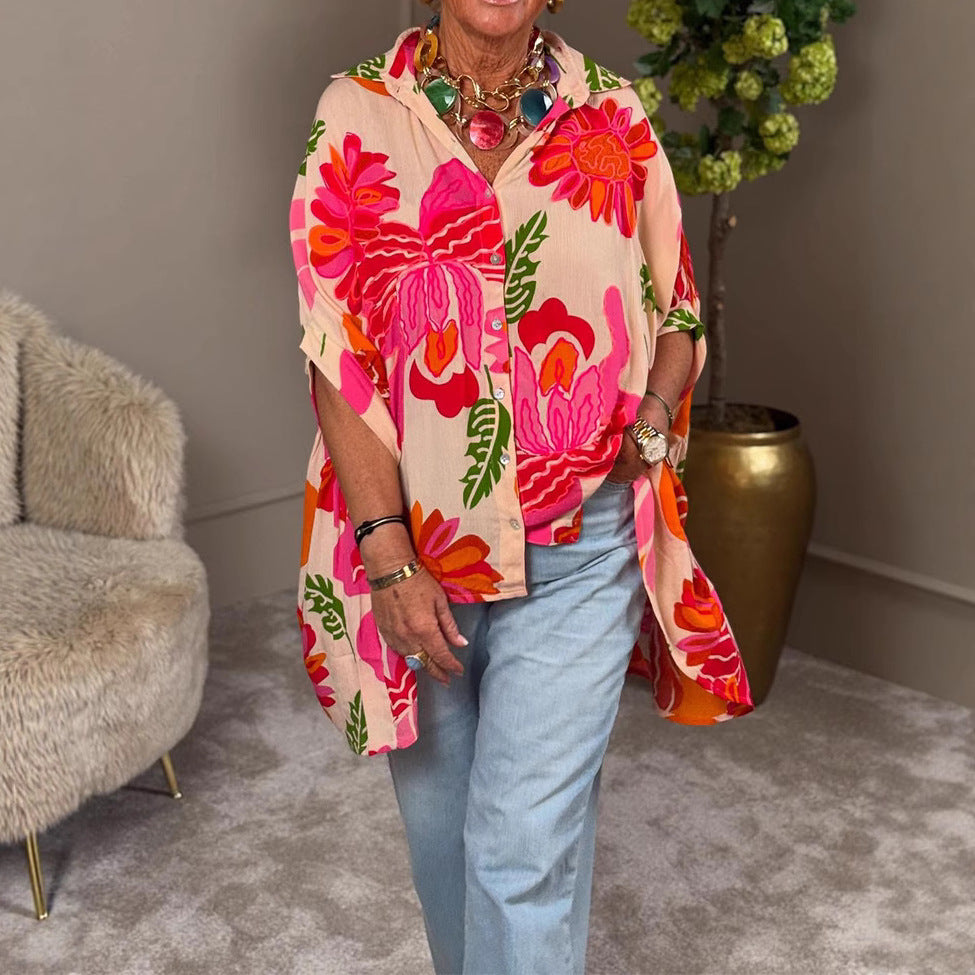 Women's airy oversized resort-style shirt blouse with large floral print and asymmetrical scalloped hem Mune Fashion