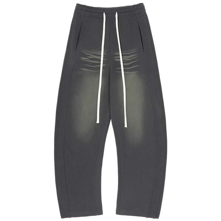 Men's baggy sweatpants with low crotch, contrasting decorative seams, and extra long drawstrings.