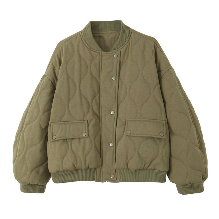 Women's quilted bomber jacket with oversized silhouette, ribbed cuffs, and flap pockets Mune Fashion