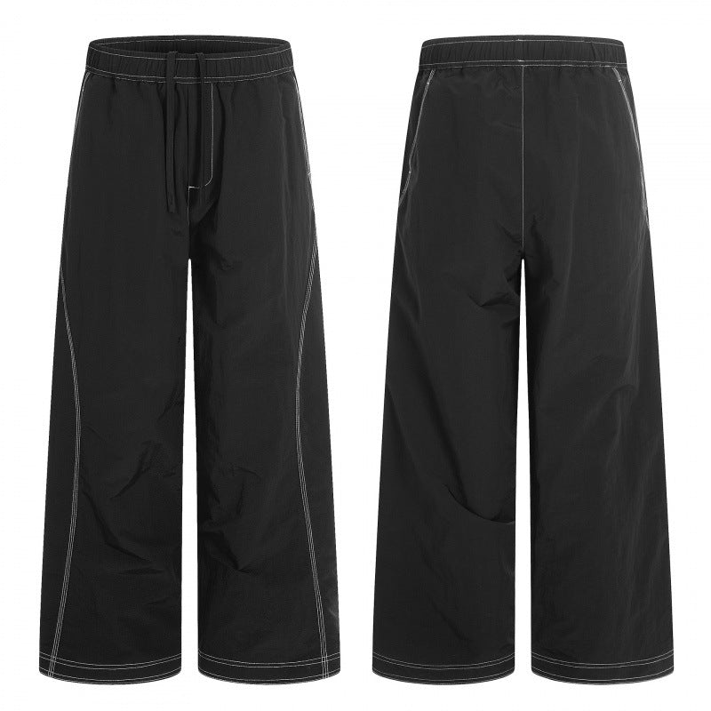 Women's wide pants with elastic waistband, drawstring and contrasting decorative seams Mune Fashion