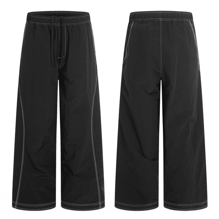 Women's wide pants with elastic waistband, drawstring and contrasting decorative seams Mune Fashion