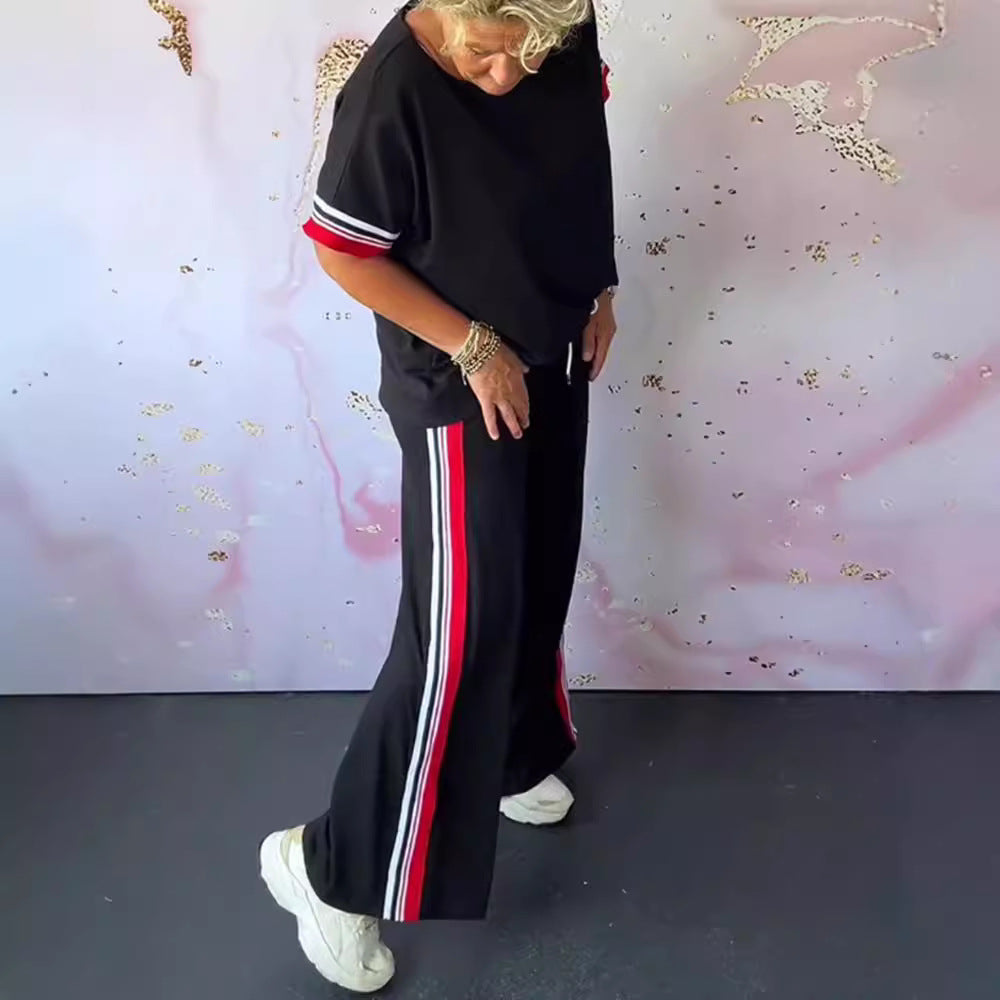 Ladies' sporty-elegant two-piece set with boxy short sleeve shirt, drawstring jog pants, and side contrast stripe Mune Fashion