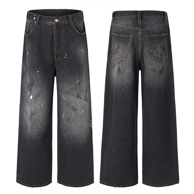 Men's loosely cut denim pants in floor-length baggy style with subtle paint splatter look Mune Fashion