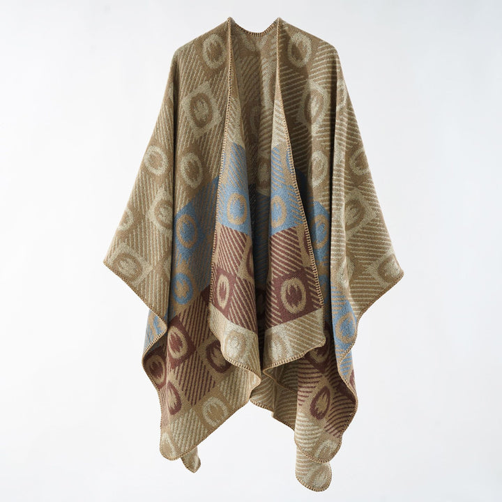 Women's jacquard wrap poncho made of fine knit with graphic circle jacquard and open kimono silhouette.