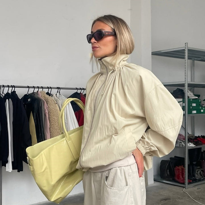 Women's Oversize Windbreaker with high stand-up collar, drawstring shoulder yoke, and balloon sleeves Mune Fashion