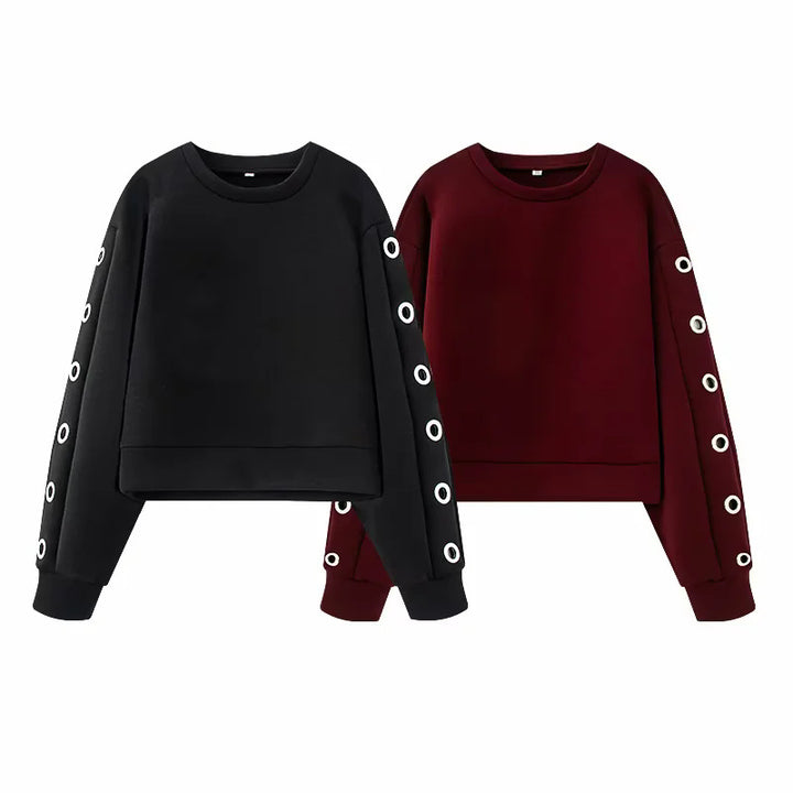 Women's oversized sweatshirt with decorative metal eyelets on the sleeves Mune Fashion