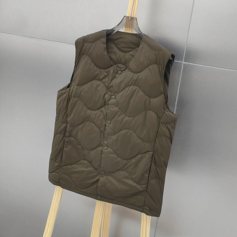 Women’s sleeveless thermal quilted vest with wave-shaped quilting and snap button closure Mune Fashion