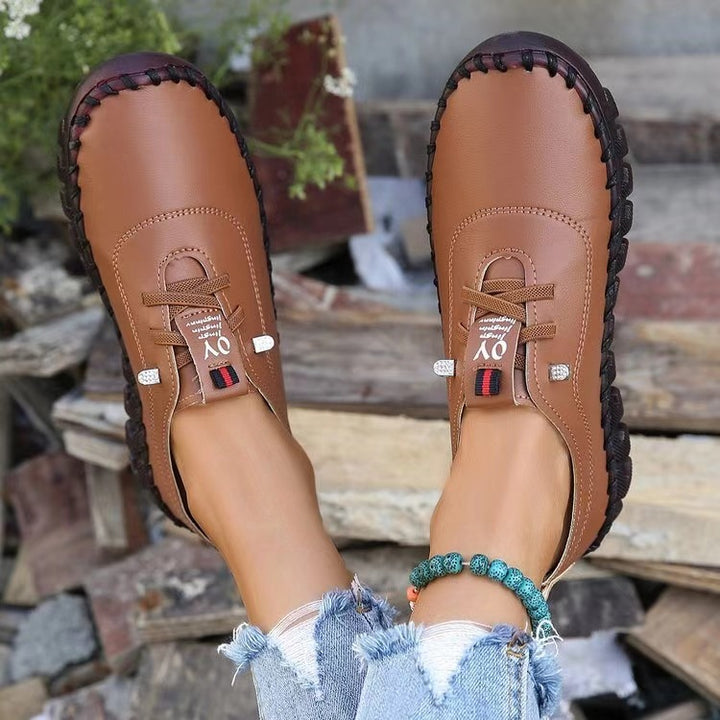 Women's hand-sewn moccasin loafers with elastic lacing, padded comfort insole, and patterned rubber sole Mune Fashion