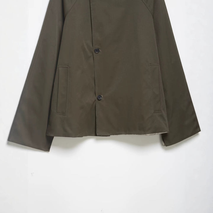 Men's short water-repellent transitional jacket with high stand-up collar, asymmetrical button placket, and raglan sleeves Mune Fashion