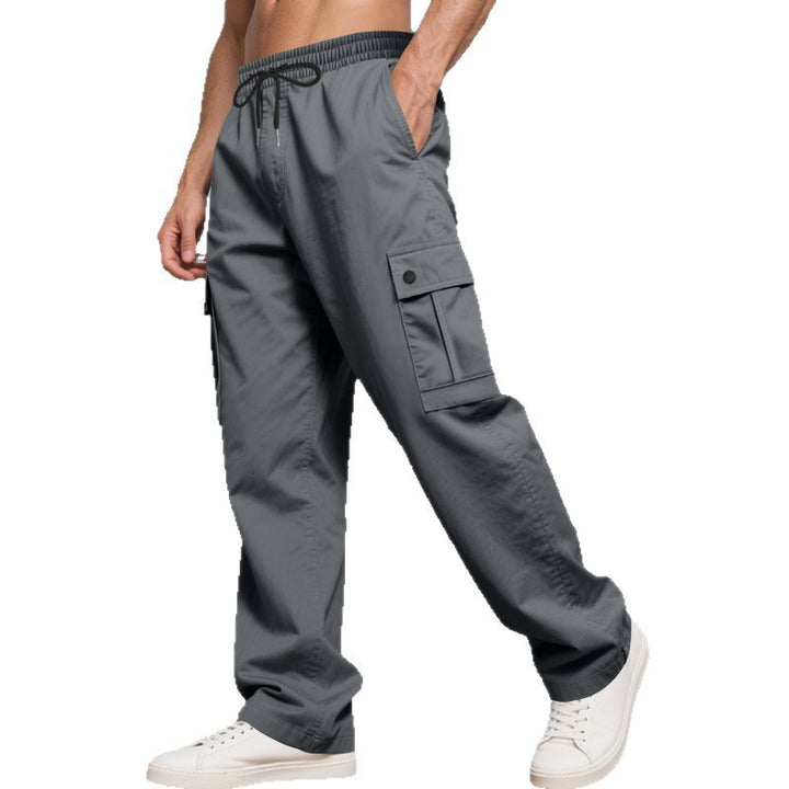 Men's cargo leisure pants with wide legs, elastic waistband, and multiple flap pockets Mune Fashion