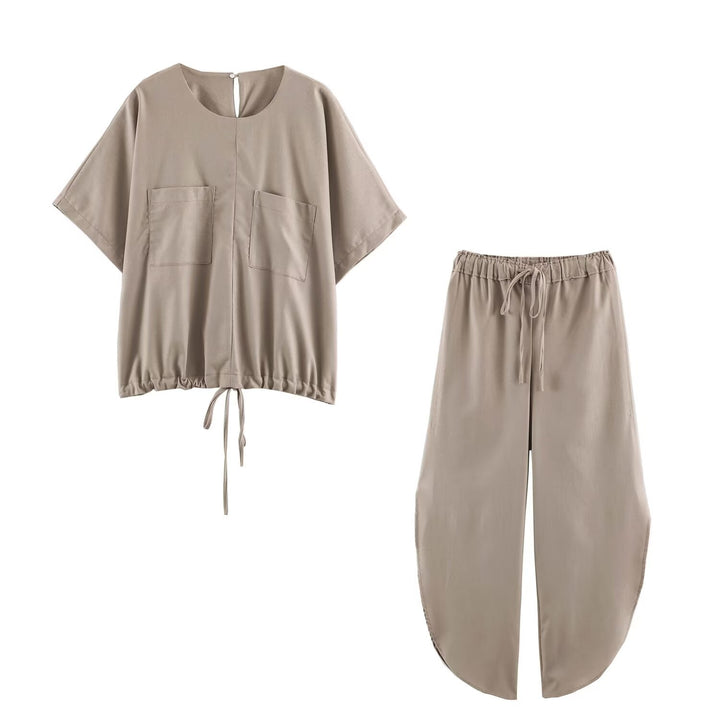 Ladies loose-fitting harem pants with drawstring waistband, mid-slit, and rounded hem Mune Fashion