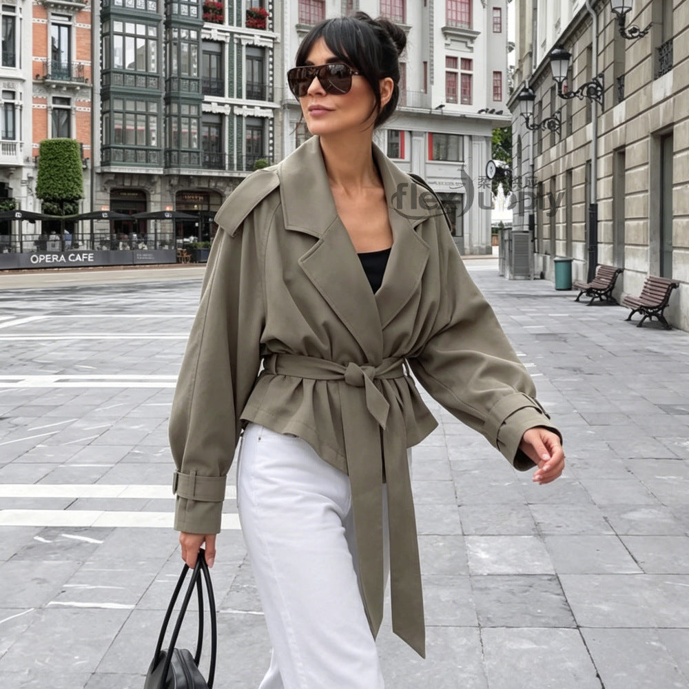 Women non-woven cropped jacket with oversized raglan sleeves and wide tie belt Mune Fashion
