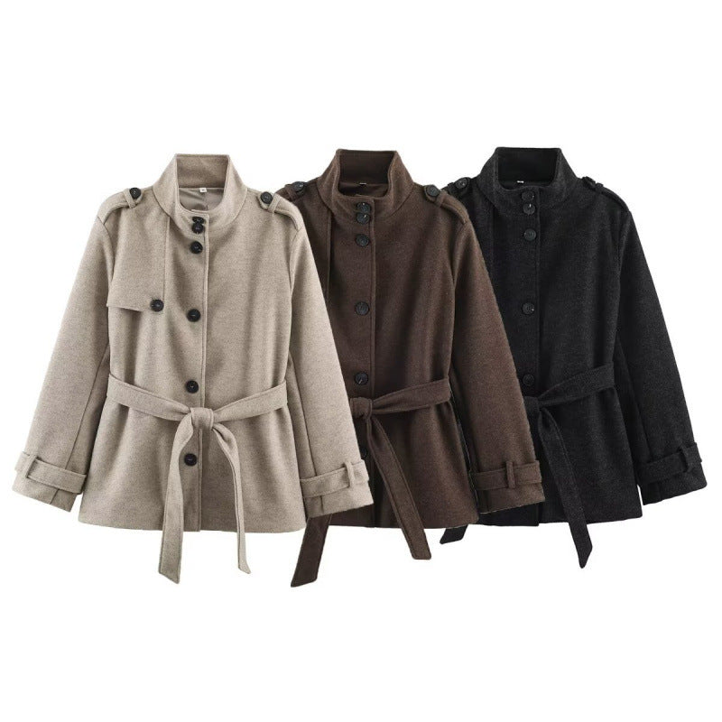 Women's short tailored coat jacket made of wool blend with standing collar, shoulder patches, and tie belt Mune Fashion