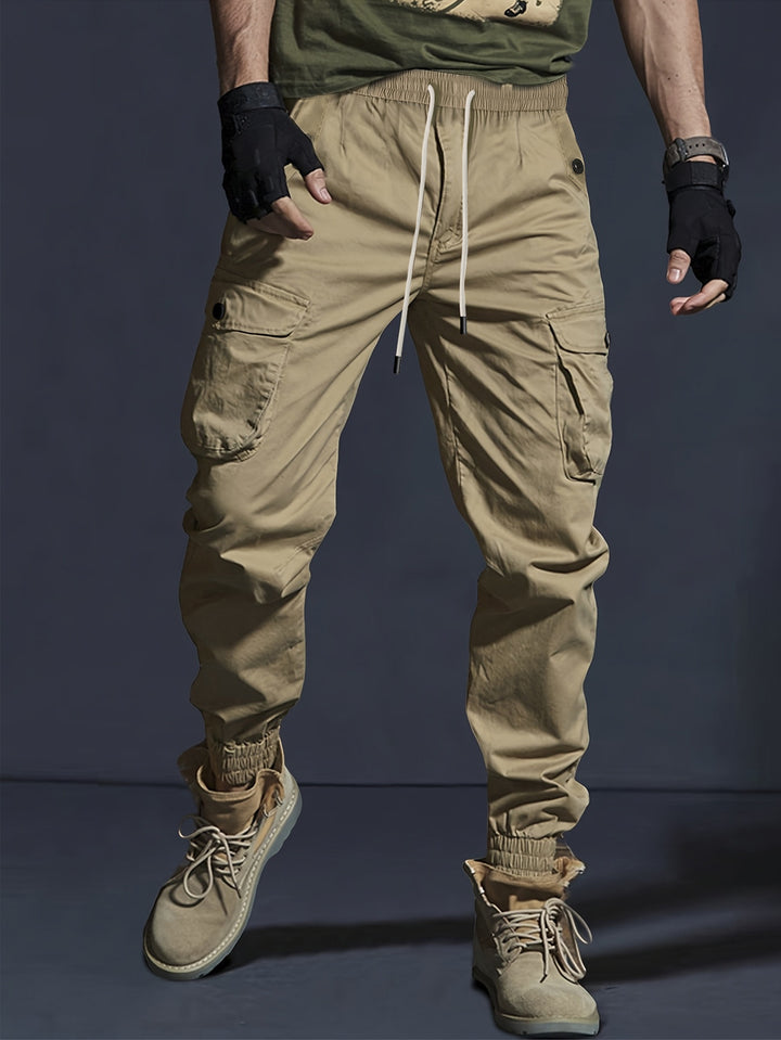 Men's cargo jogger pants with elastic waistband, drawstring, and multifunctional pockets.