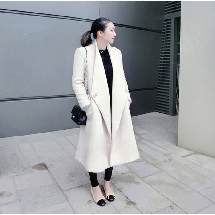 Women's midi-length tailored wool blend long coat with shawl collar, inset pockets, and discreet decorative buttons Mune Fashion