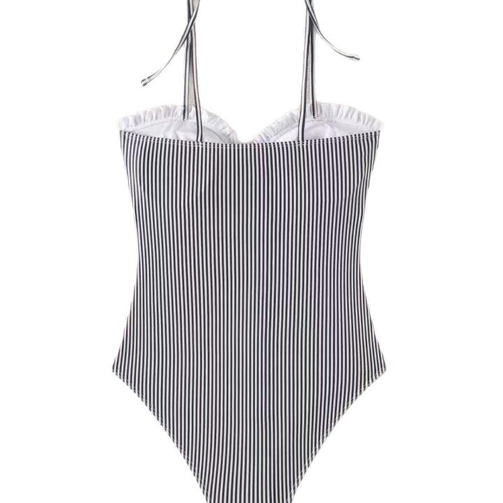 Women's jumpsuit with a flowing cut and playful ruffle details Mune Fashion