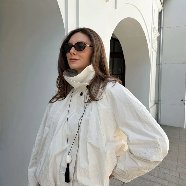 Women's short jacket with high stand-up collar, gathered shoulder area, and elastic hem Mune Fashion