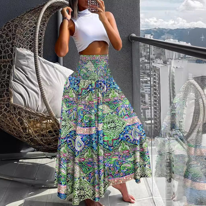 Women's maxi skirt with high smocked waistband, wide fall, and paisley print Mune Fashion