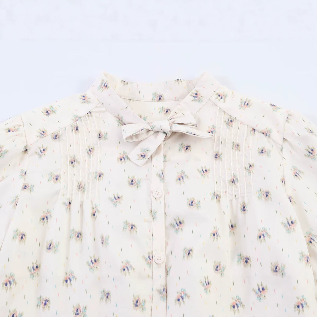 Women's chiffon blouse with bow collar, chest pintucks and peplum Mune Fashion