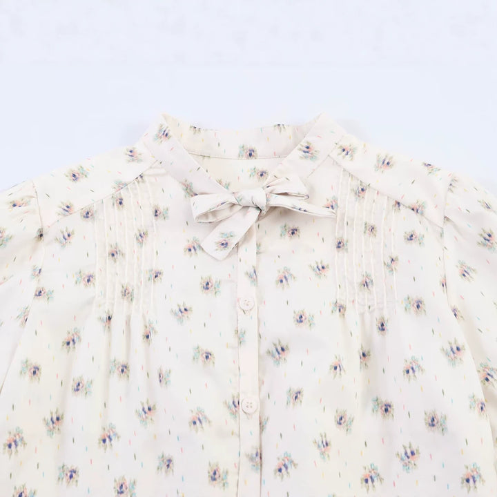 Women's chiffon blouse with bow collar, chest pintucks and peplum Mune Fashion