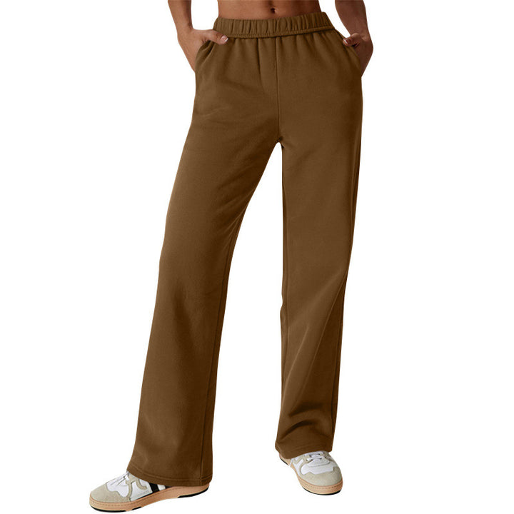 Women's high-cut loose jogging pants made of soft sweat fabric with elastic waistband and side pockets Mune Fashion