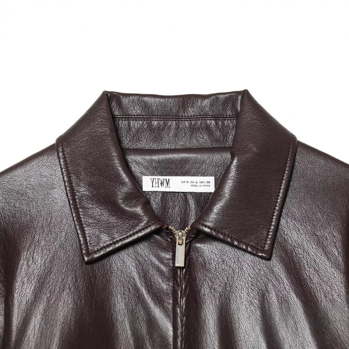 Women's short jacket in vegan leather look with cinching drawstring and flap pockets Mune Fashion