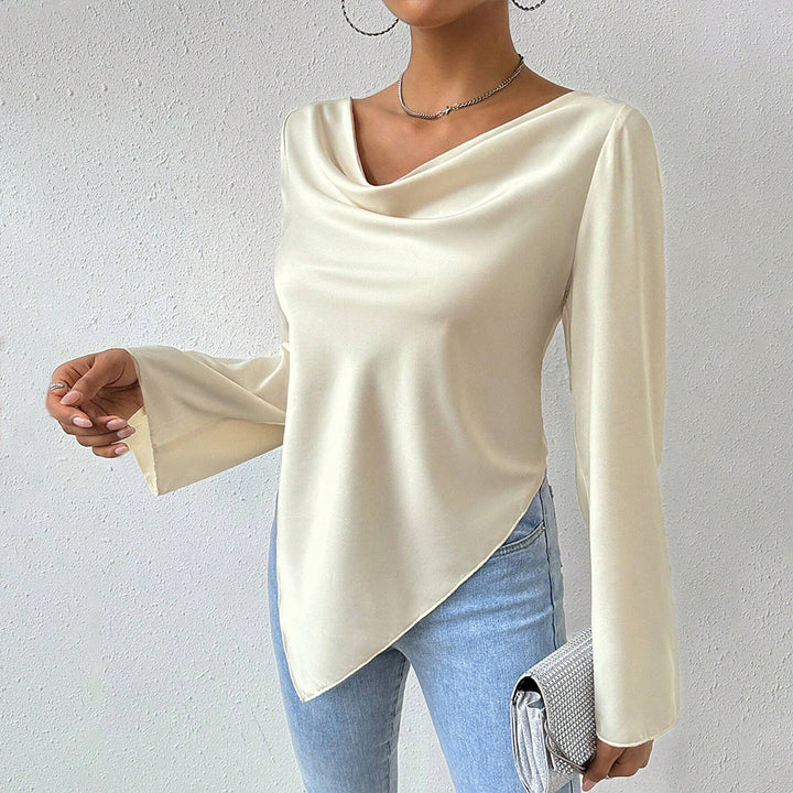 Women's blouse with waterfall neckline, wide trumpet sleeves and flowing satin look.