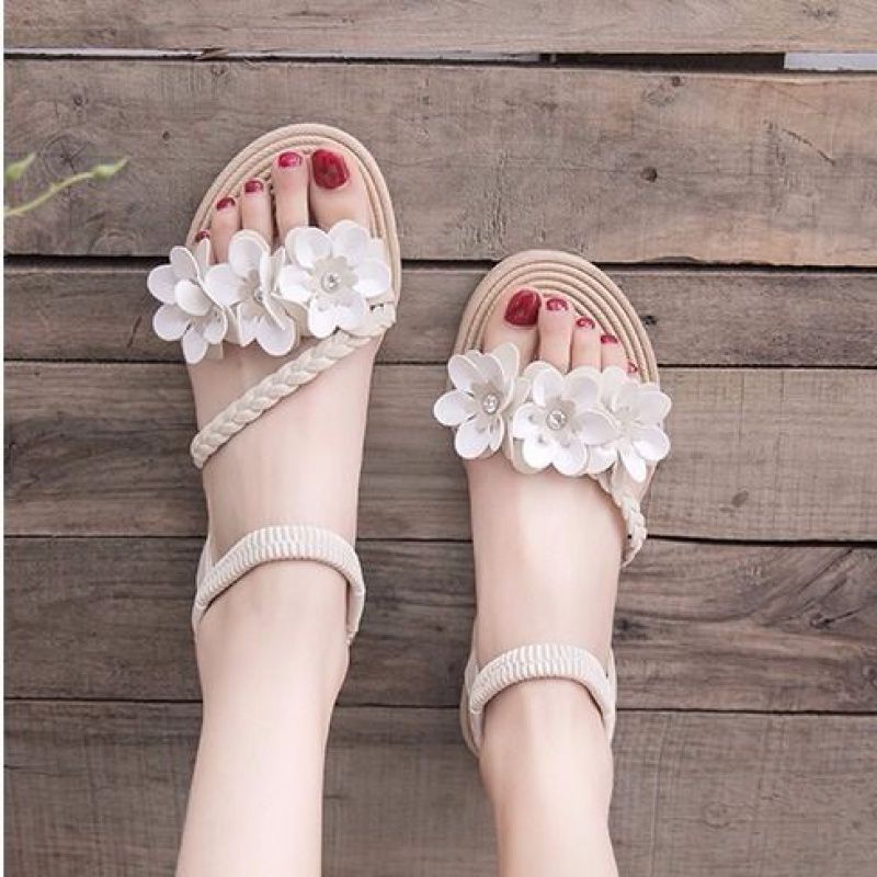 Women's playful strap sandal with braided decorative bands, flower appliqués, and elastic heel strap Mune Fashion