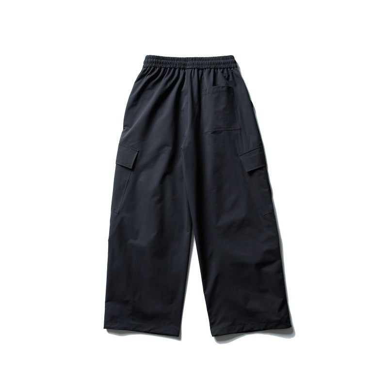 Unisex Wide Cargo Utility Pants in Baggy Cut with Elastic Drawstring Waist and Generous Flap Pockets