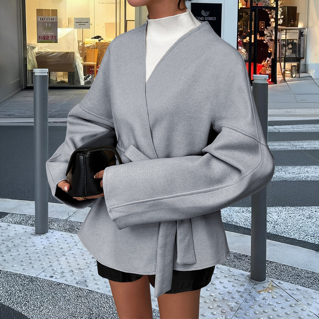 Women’s light wrap coat with tie belt, dropped sleeves and feminine waist emphasis Mune Fashion