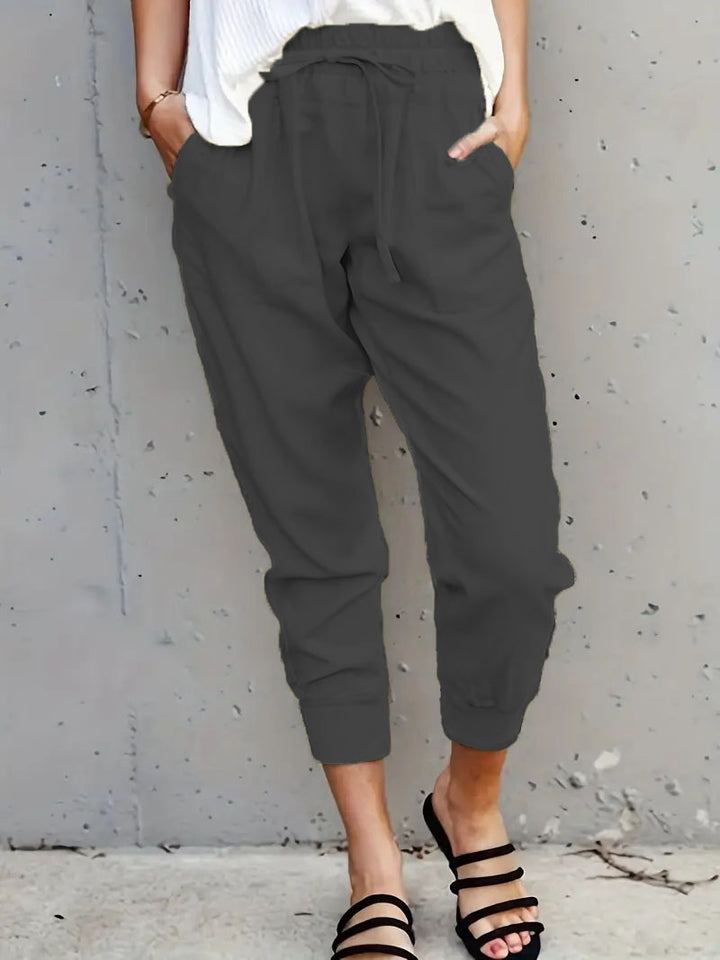 Women's jogging pants with elastic waistband, drawstring and leg cuffs Mune Fashion