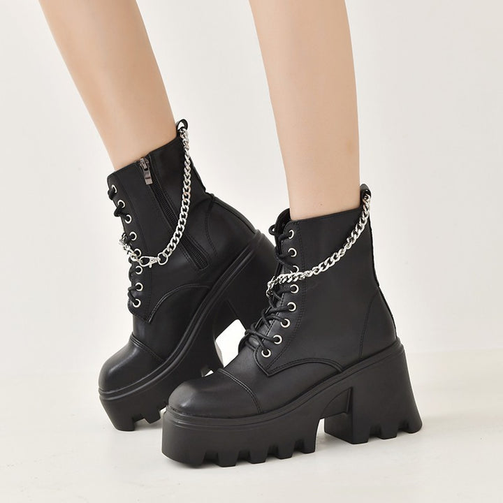 Ladies high-cut platform biker ankle boots in patent look with lacing, side zipper, and decorative buckle and stud application Mune Fashion