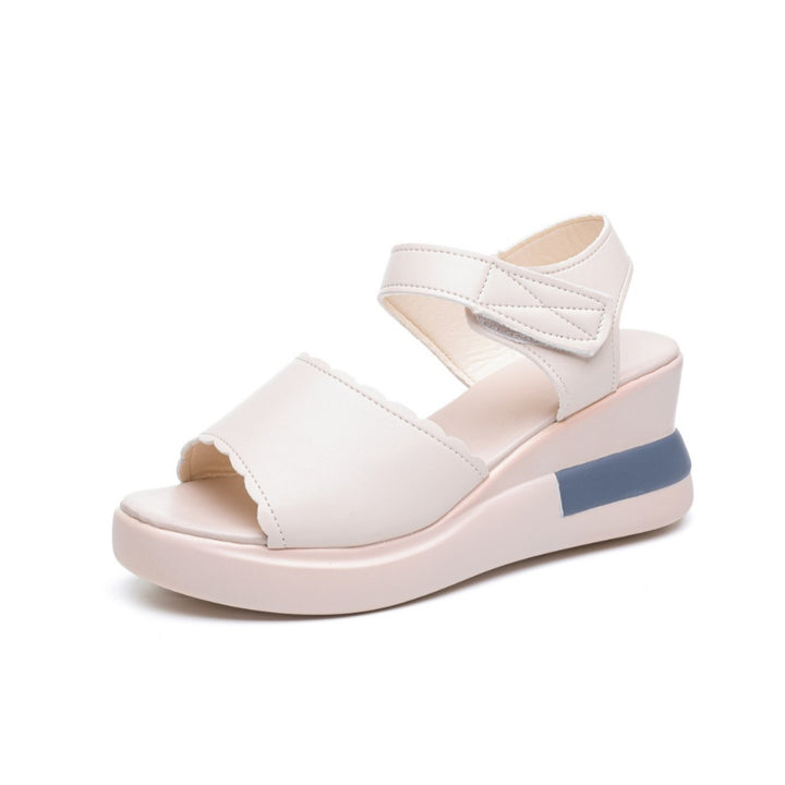 Ladies' platform slide with crossed leather-look straps and ergonomic footbed Mune Fashion