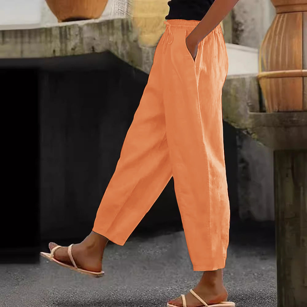 Women's loose-fitting linen blend pants with elastic waistband, drawstring, and angled side pockets Mune Fashion