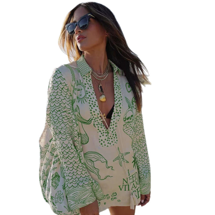 Ladies lightweight beach cover-up in tunic form with deep V-neck, tassel closure, and nautical ocean print Mune Fashion