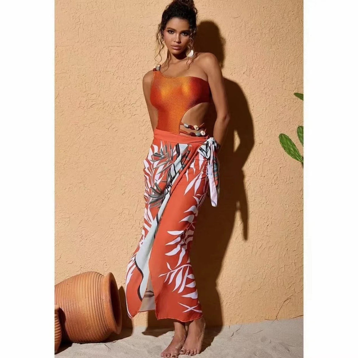 Women’s one-piece swimsuit with asymmetric cut and floral wrap skirt Mune Fashion