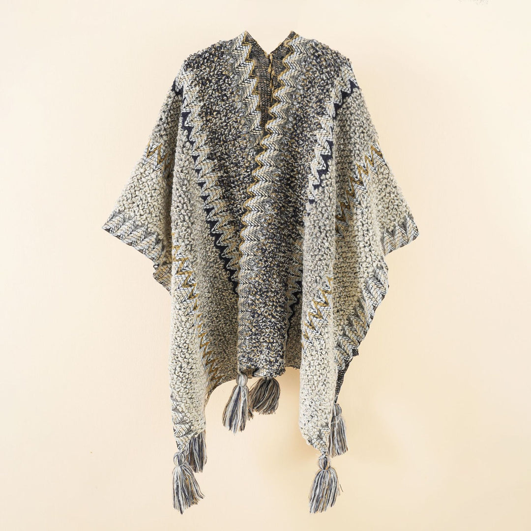 Women's structured bouclé knit poncho with jacquard pattern and tassels Mune Fashion