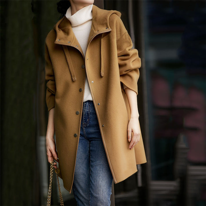 Women's mid-length wool blend coat with hood and snap button placket in oversized fit Mune Fashion