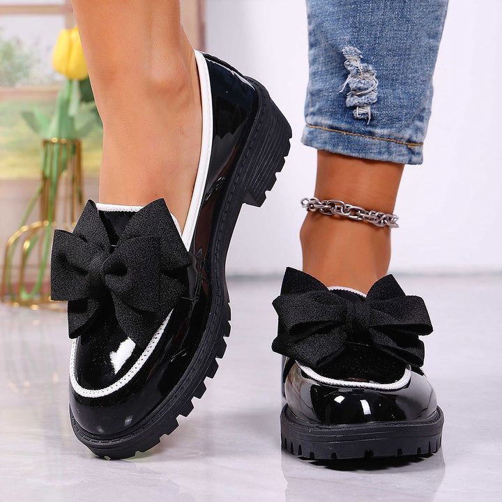 Women's patent leather platform loafers with patterned rubber sole and decorative bow Mune Fashion