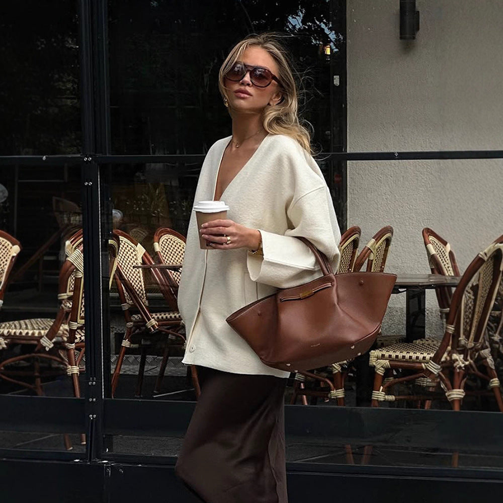Women's chunky knit cardigan with deep V-neckline, boxy oversized silhouette and patch pockets Mune Fashion