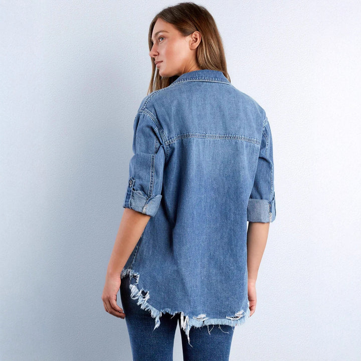 Women's casual denim shirt jacket oversized with patch chest pockets, heart embroidery detail, and frayed hem Mune Fashion