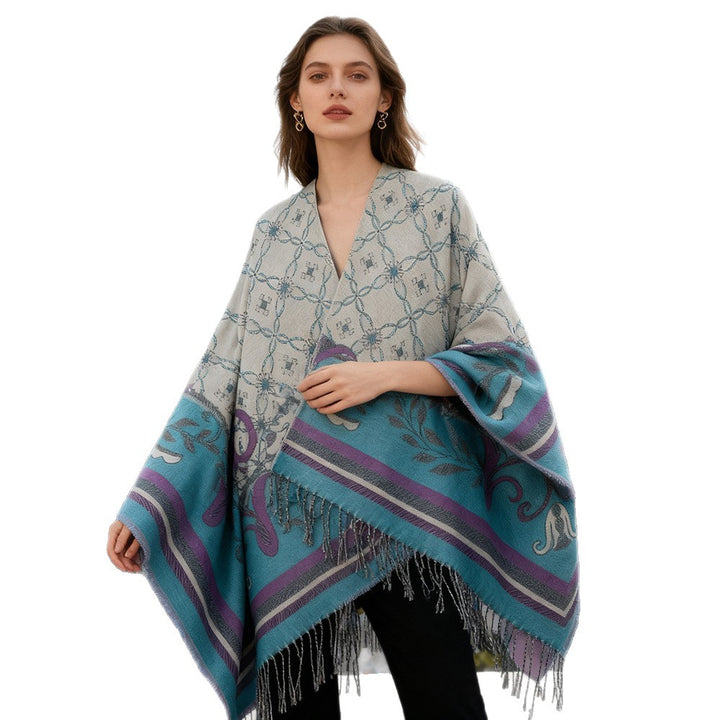 Women's jacquard reversible cape with V-neck, floral border and fringe hem Mune Fashion