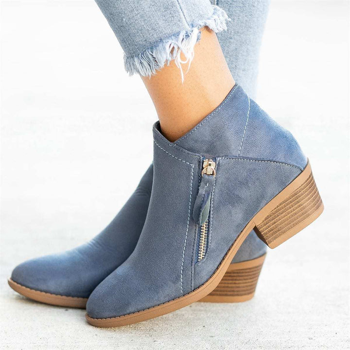 Ladies ankle-high suede-look ankle boots with a sleek round toe, side metal zipper, and stacked block heel Mune Fashion