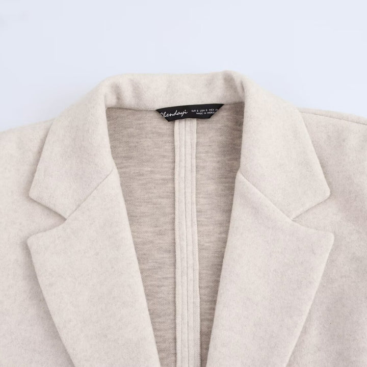 Ladies Purist longline coat with lapel collar, single button closure and soft felt finish Mune Fashion