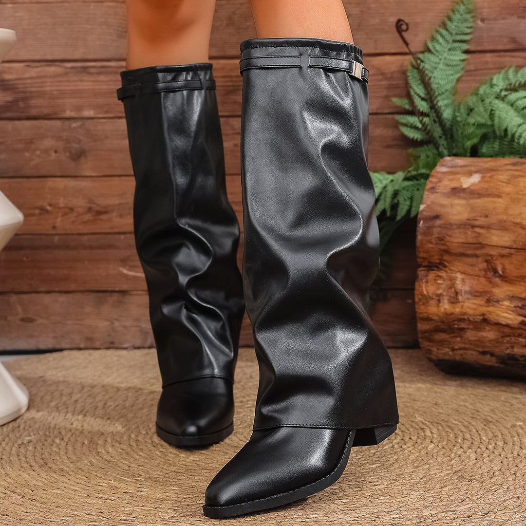 Women's knee-high slouch boots with pointed toe, low block heel, and decorative shaft strap Mune Fashion